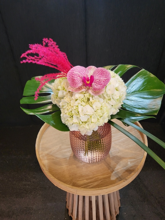 FABULOUS MODERN HYDRANGEA AND ORCHID COMBINATION IN PINK DIMPLED GLASS VASE