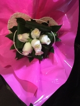 6 White roses in a white heart shaped holder